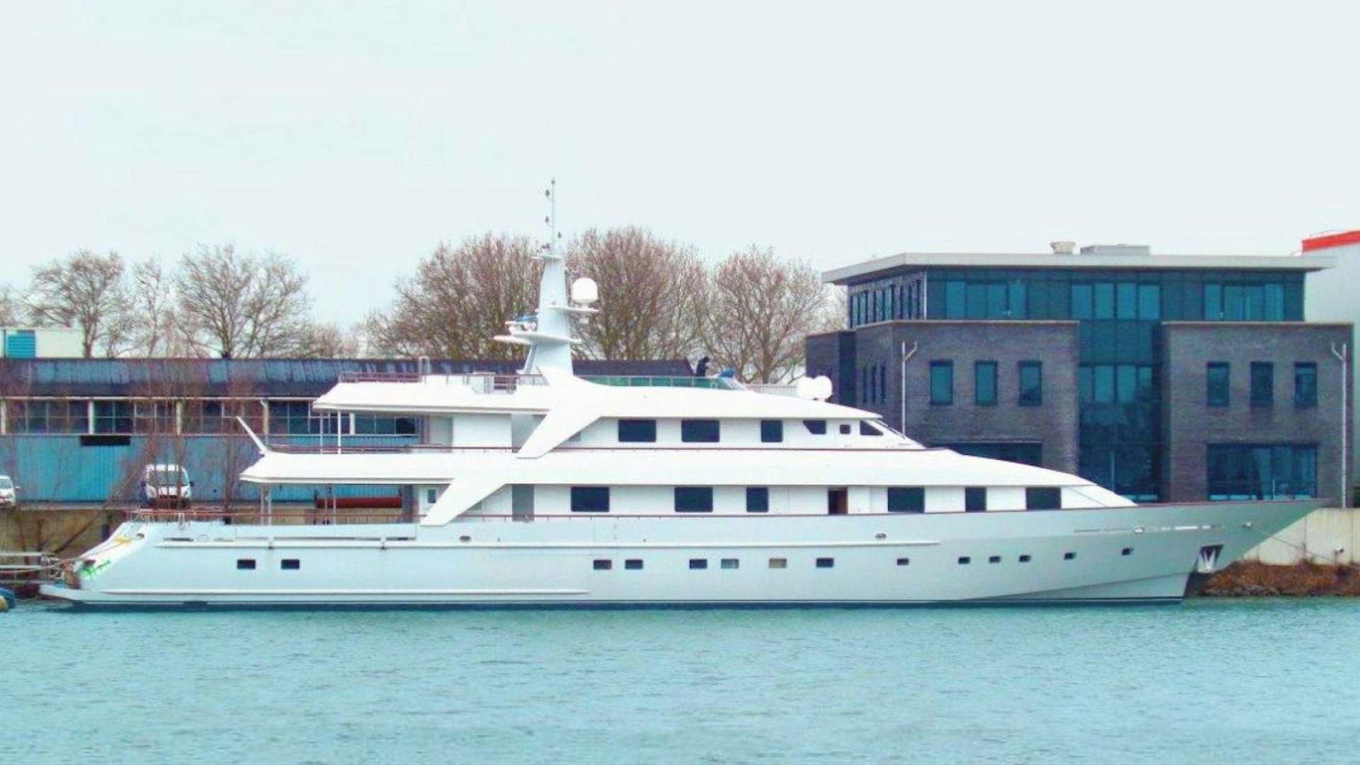 a white boat in a body of water aboard ANNA J Yacht for Sale