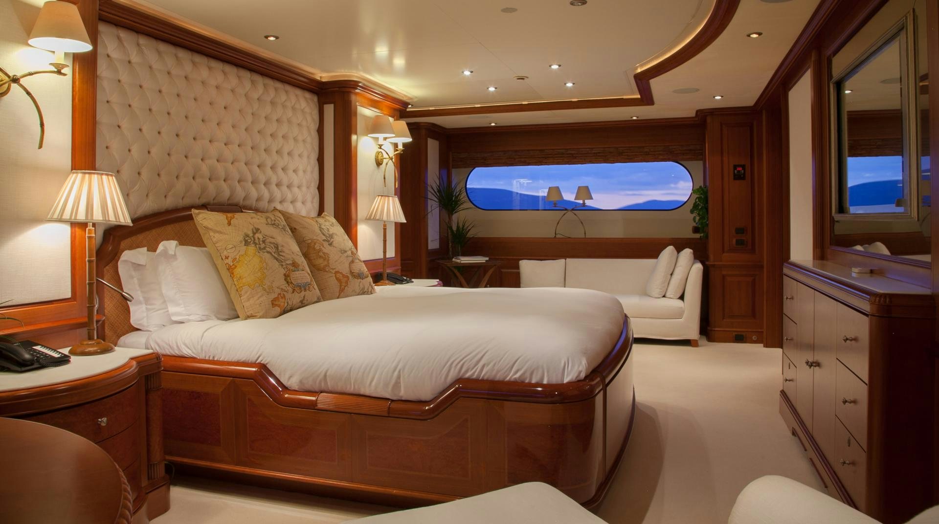 a hotel room with a bed and a tv aboard JO I Yacht for Sale
