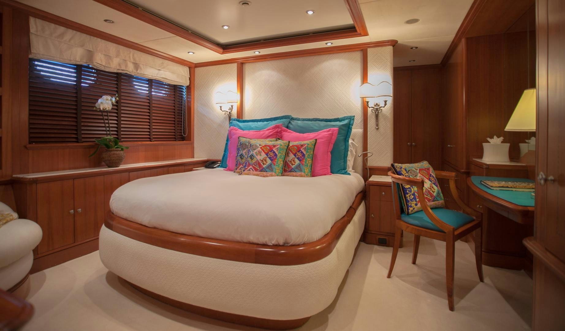 a bed in a room aboard JO I Yacht for Sale