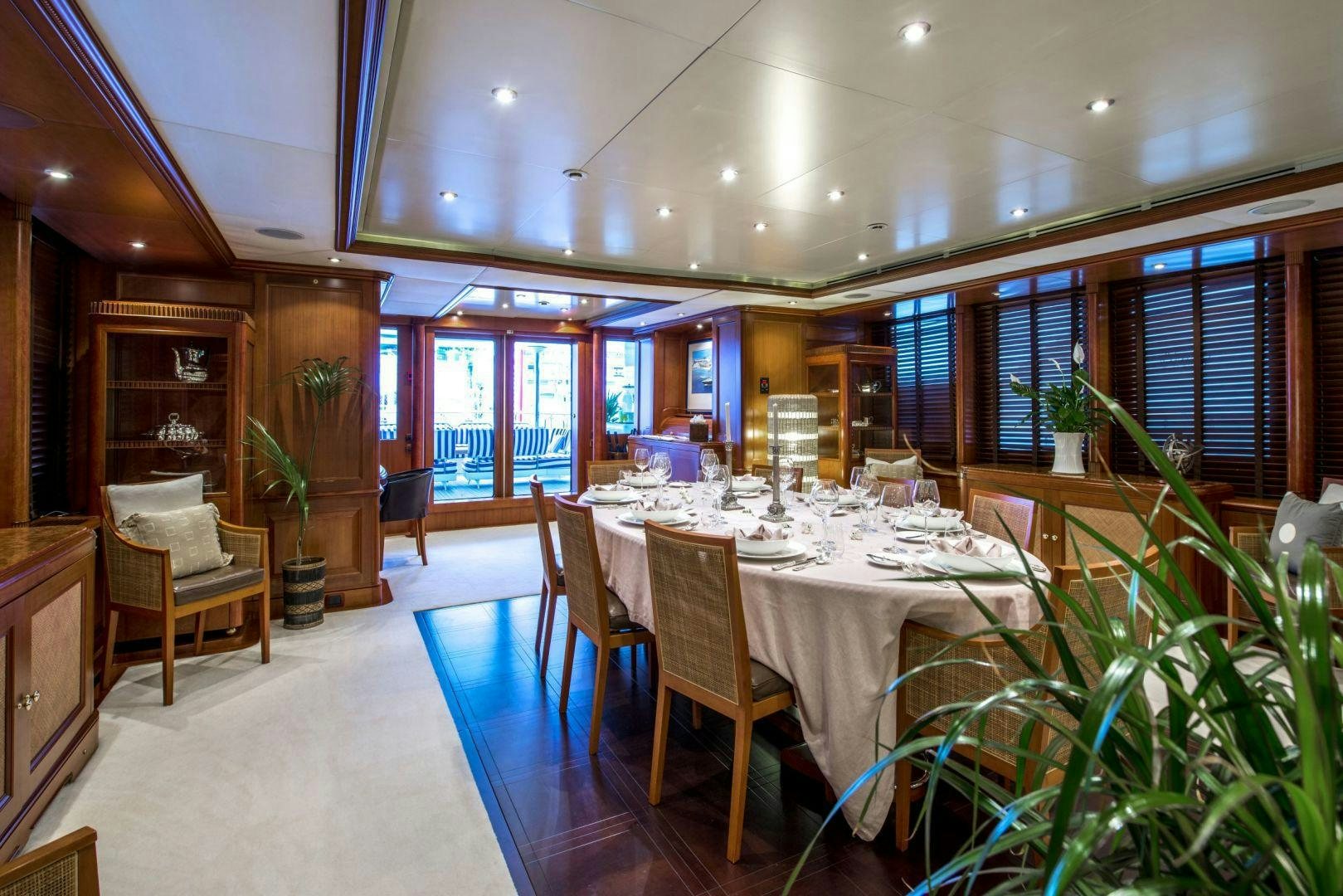 a large dining room with a large table and chairs aboard JO I Yacht for Sale