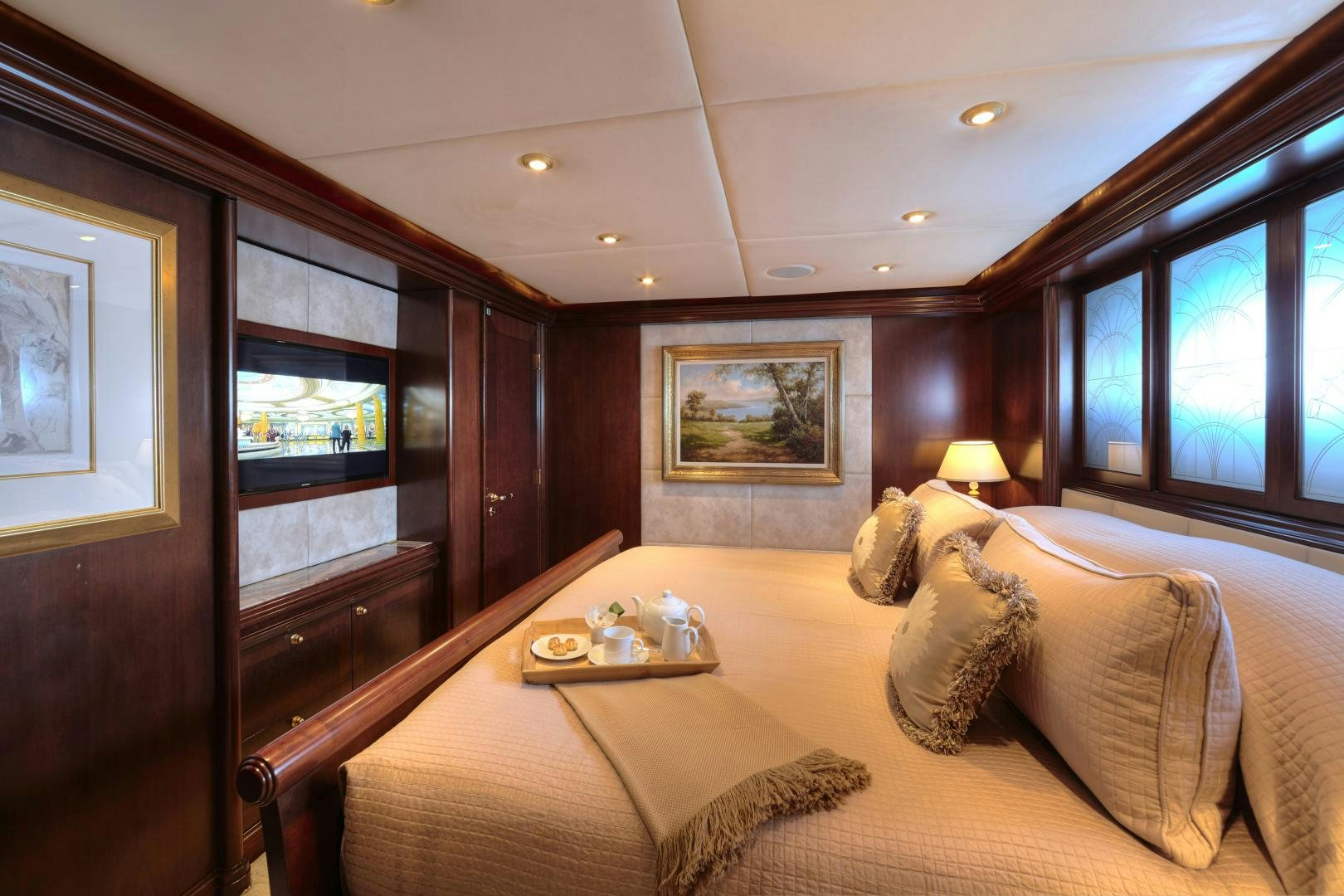 a bedroom with a bed and a desk aboard ZOOM ZOOM ZOOM Yacht for Sale