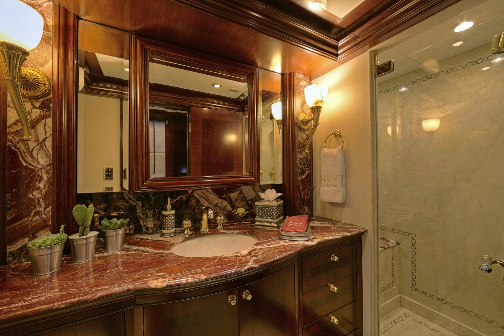 a bathroom with a large mirror aboard ZOOM ZOOM ZOOM Yacht for Sale