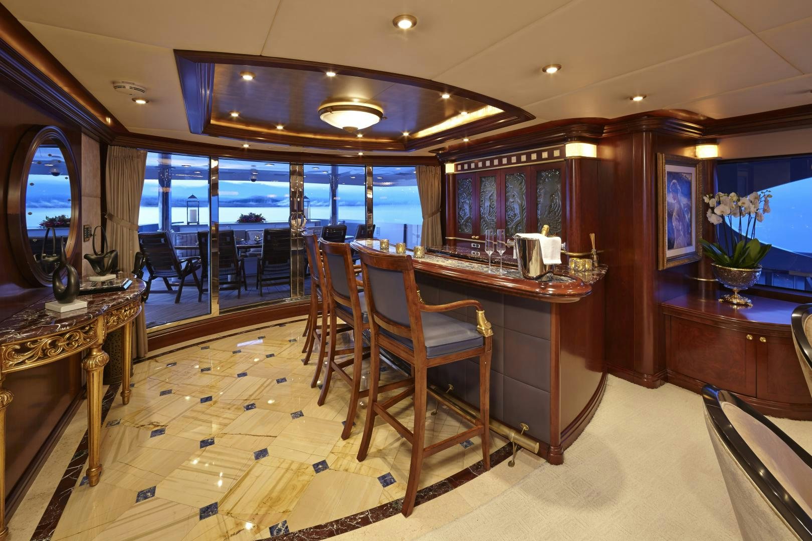 a large kitchen with a bar and dining area aboard ZOOM ZOOM ZOOM Yacht for Sale