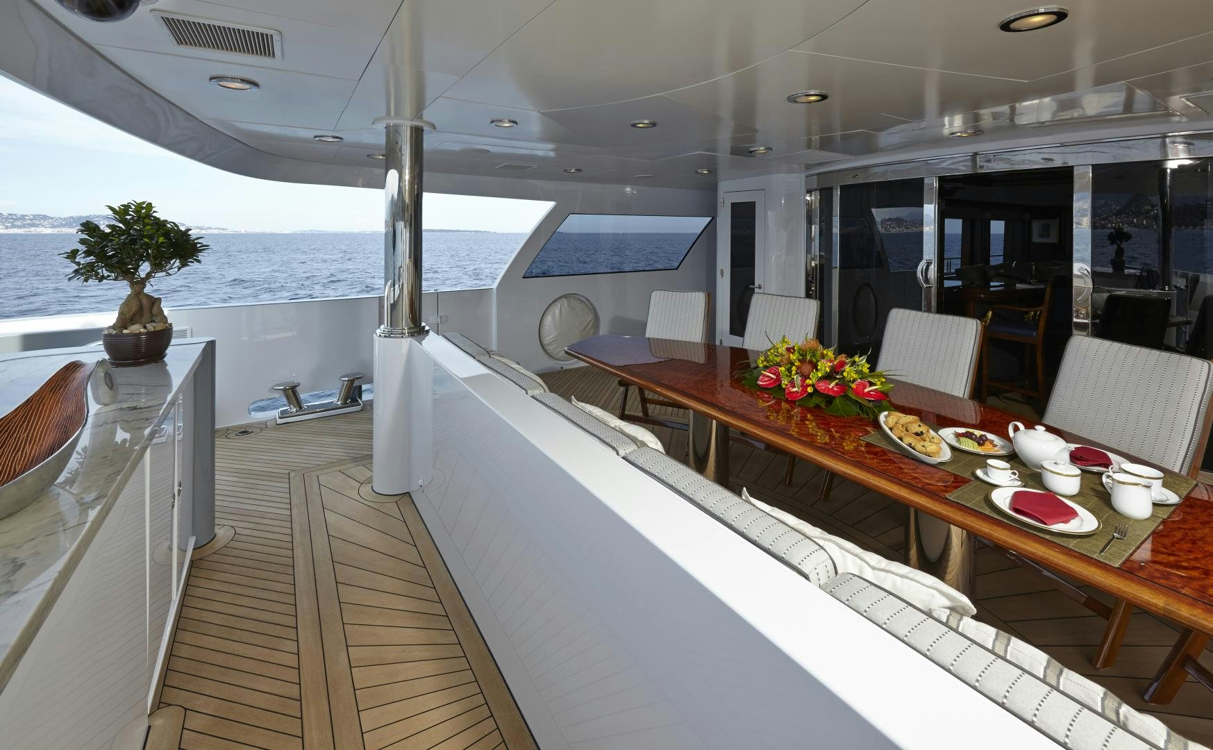 a room with tables and chairs aboard ZOOM ZOOM ZOOM Yacht for Sale