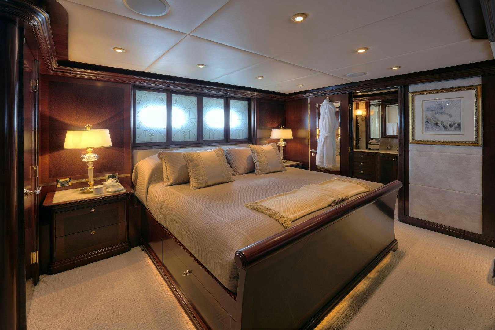 a bedroom with a bed and a desk aboard ZOOM ZOOM ZOOM Yacht for Sale
