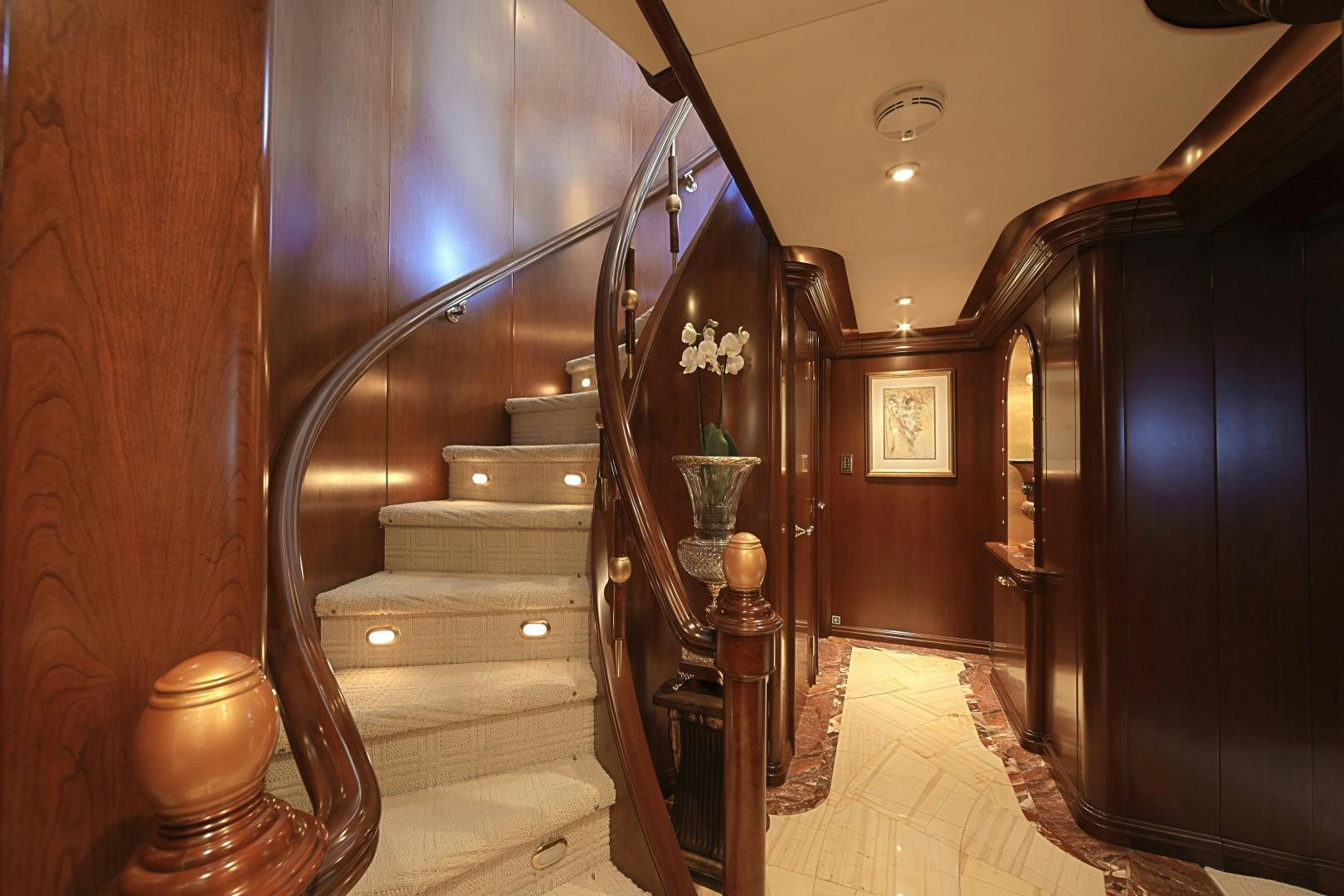 a staircase with a wood railing aboard ZOOM ZOOM ZOOM Yacht for Sale