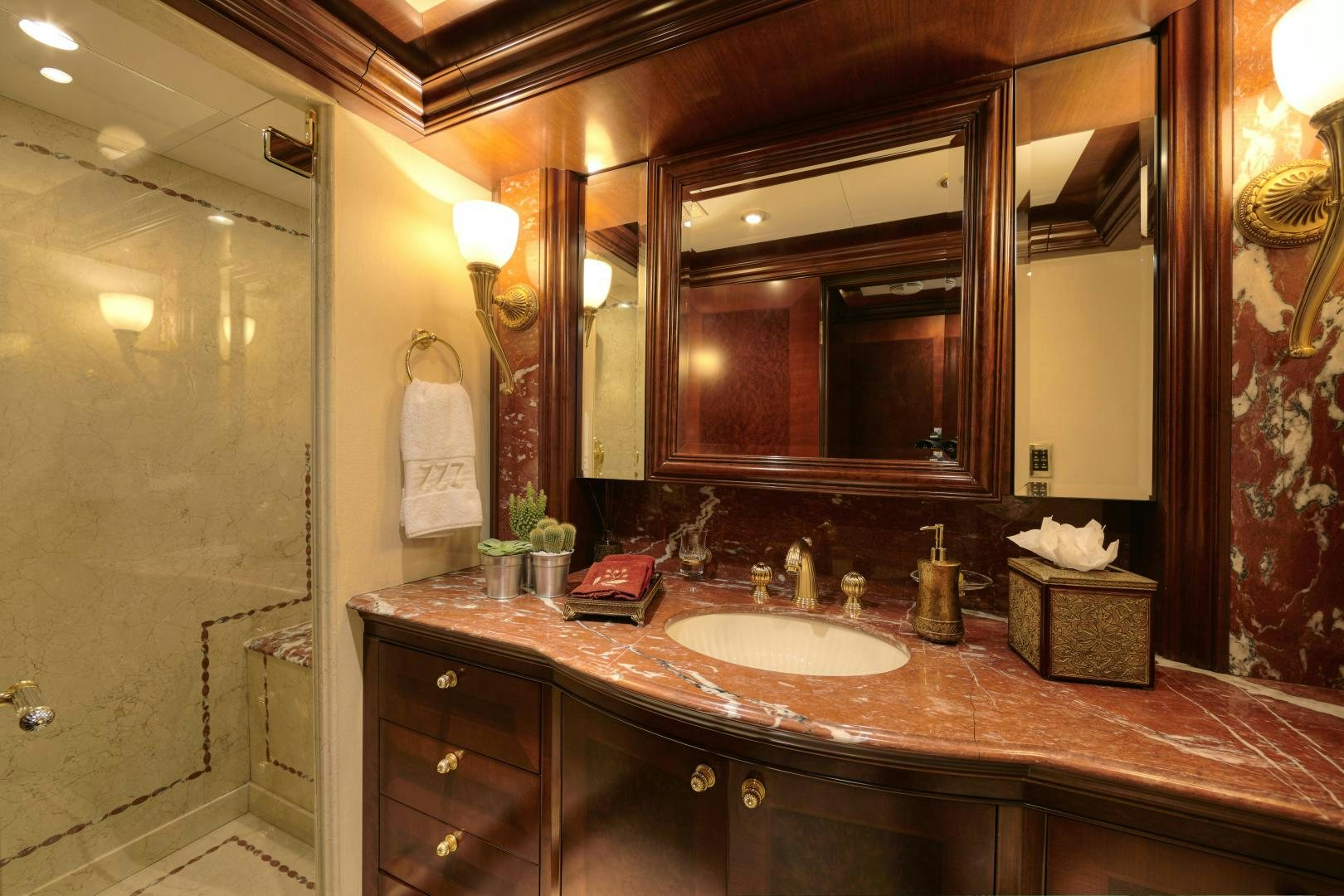 a bathroom with a large mirror aboard ZOOM ZOOM ZOOM Yacht for Sale