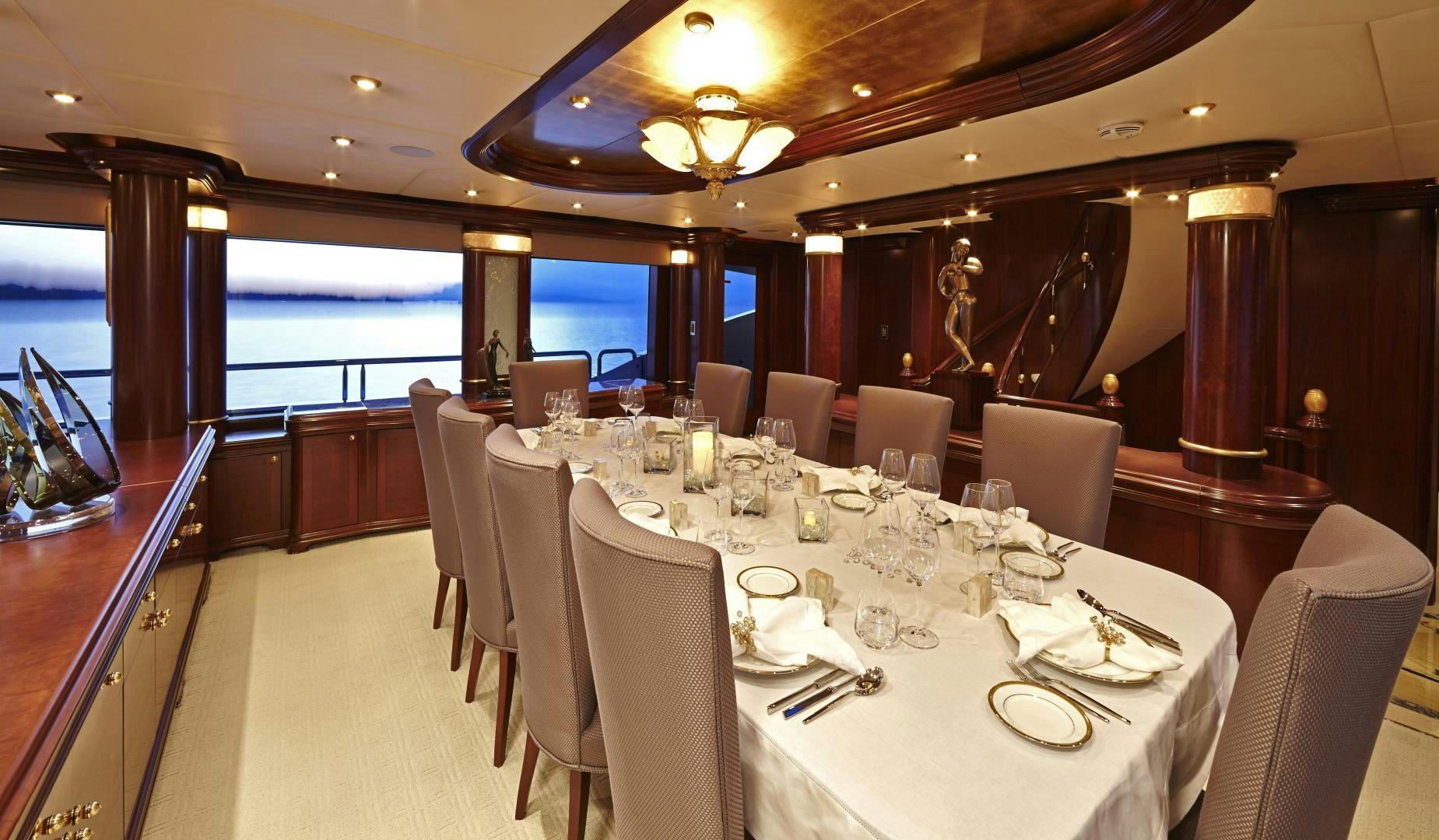 a room with tables and chairs aboard ZOOM ZOOM ZOOM Yacht for Sale