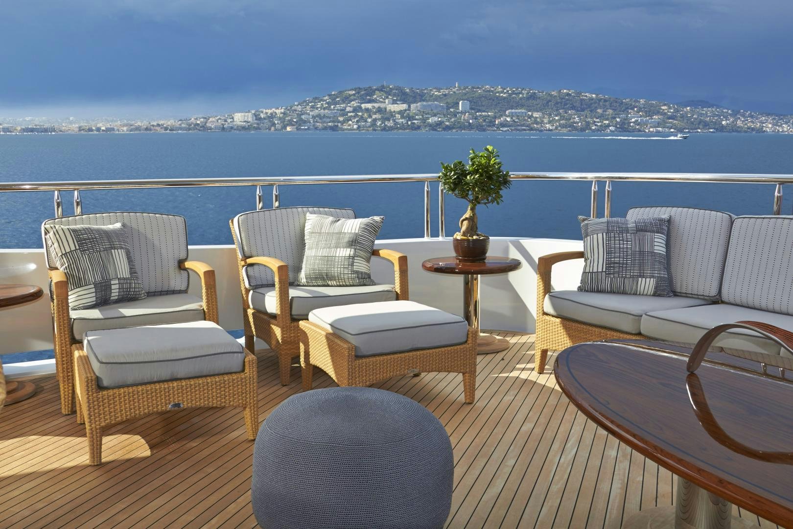 a room with a table chairs and plants on the balcony aboard ZOOM ZOOM ZOOM Yacht for Sale