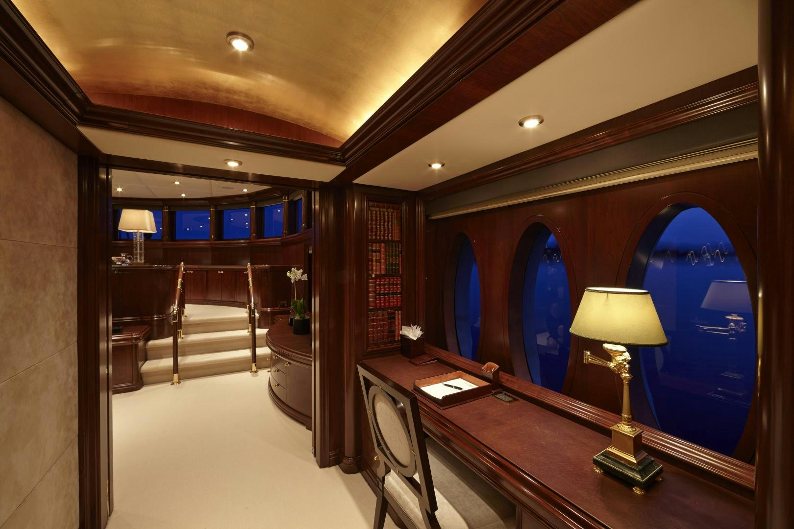 a large room with a piano and a large window aboard ZOOM ZOOM ZOOM Yacht for Sale