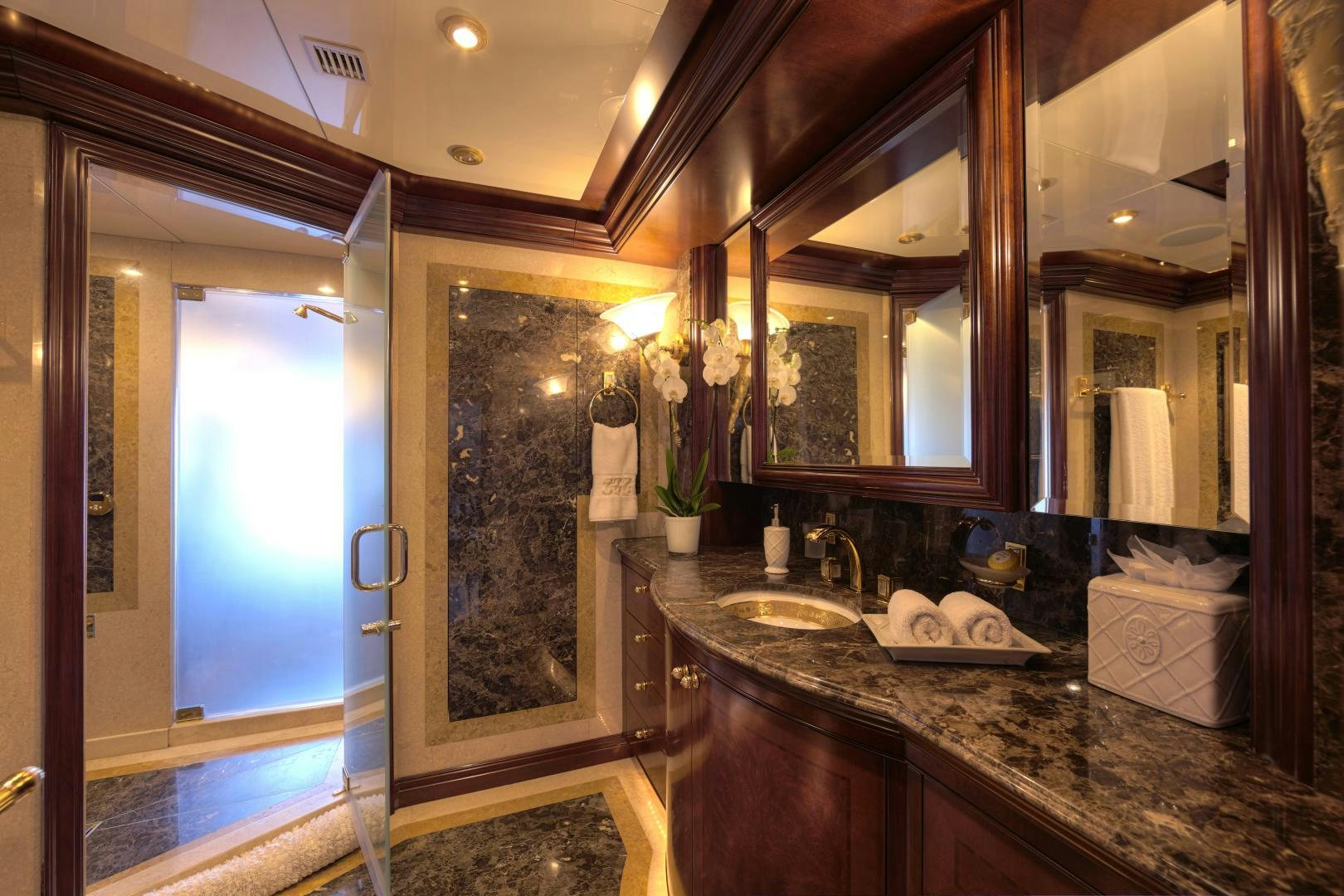 a bathroom with a large mirror aboard ZOOM ZOOM ZOOM Yacht for Sale