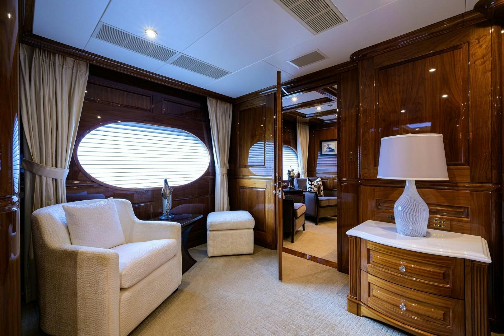 a living room with a large window aboard REMEMBER WHEN Yacht for Sale