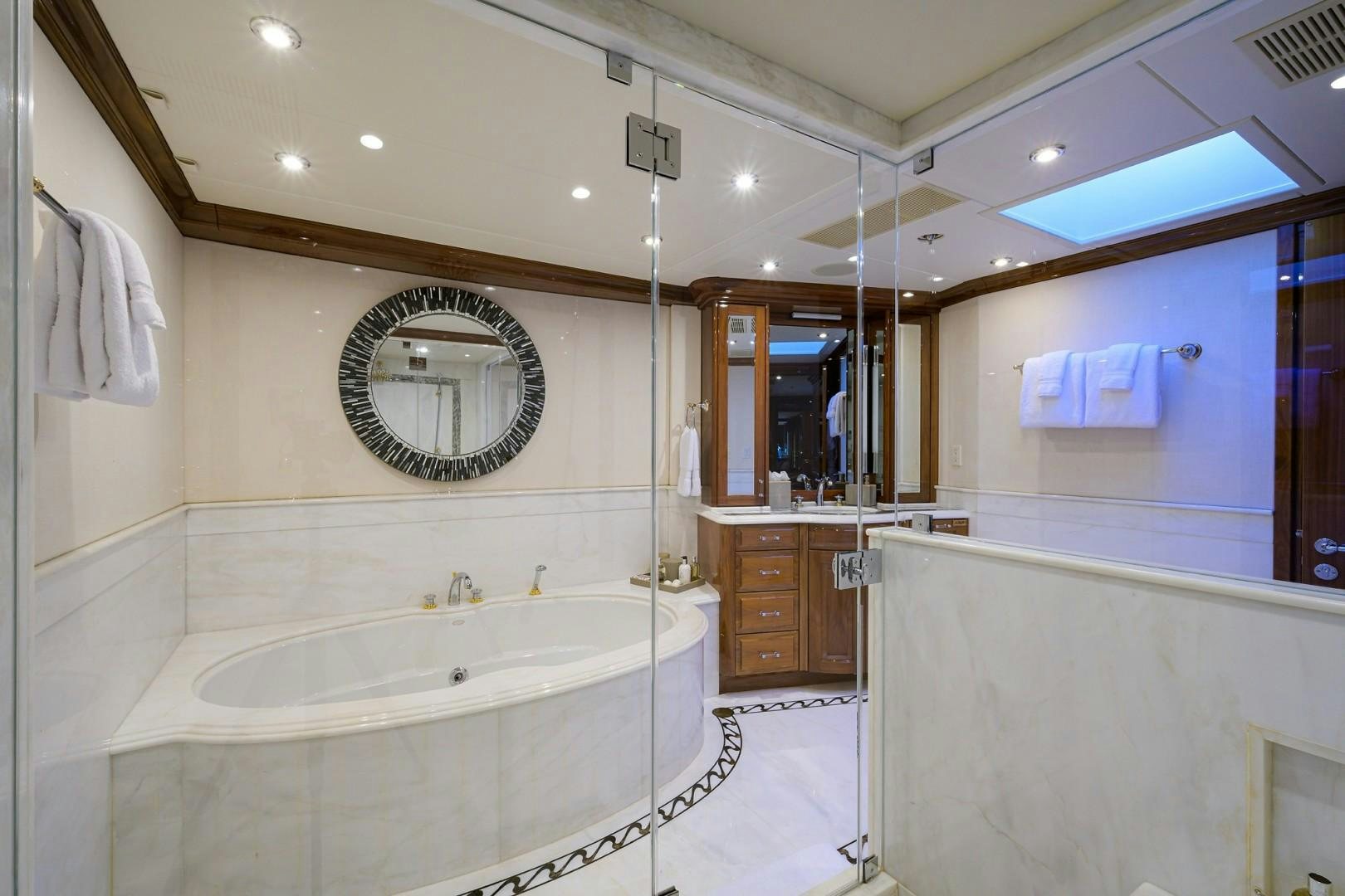 a bathroom with a tub and sink aboard REMEMBER WHEN Yacht for Sale