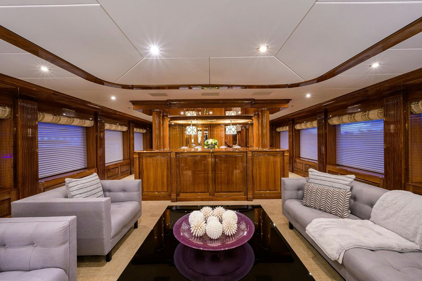 a living room with a table and couches aboard REMEMBER WHEN Yacht for Sale
