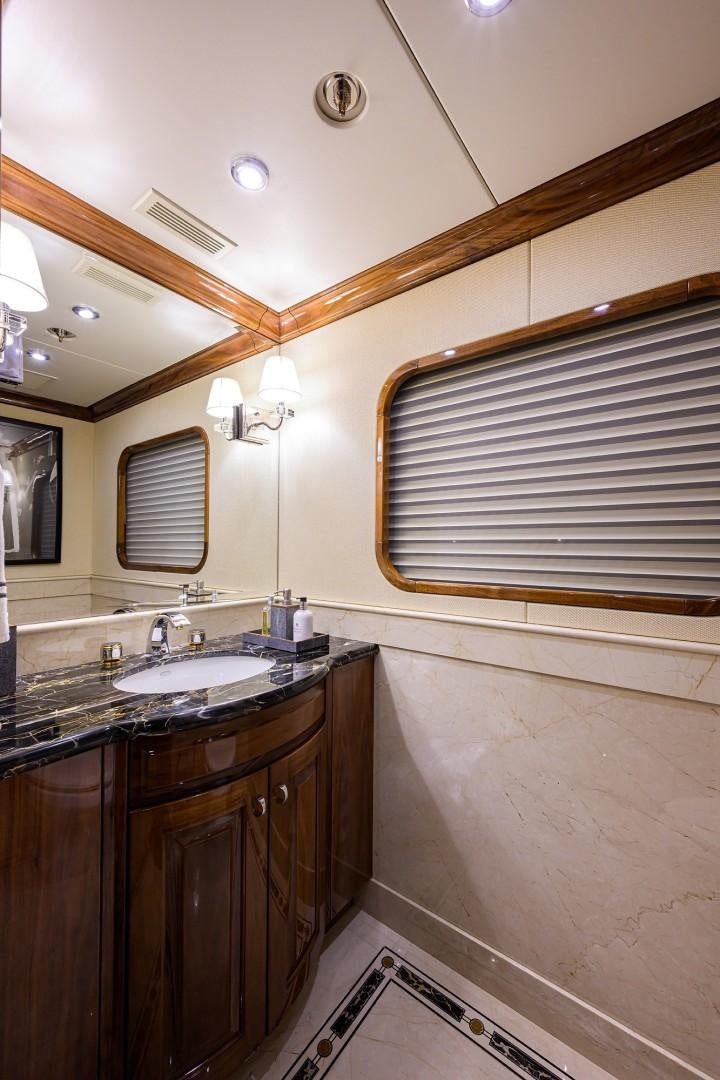 a bathroom with a sink and a mirror aboard REMEMBER WHEN Yacht for Sale