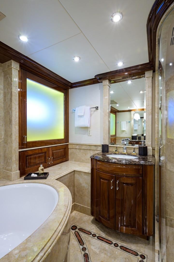 a bathroom with a large mirror aboard REMEMBER WHEN Yacht for Sale