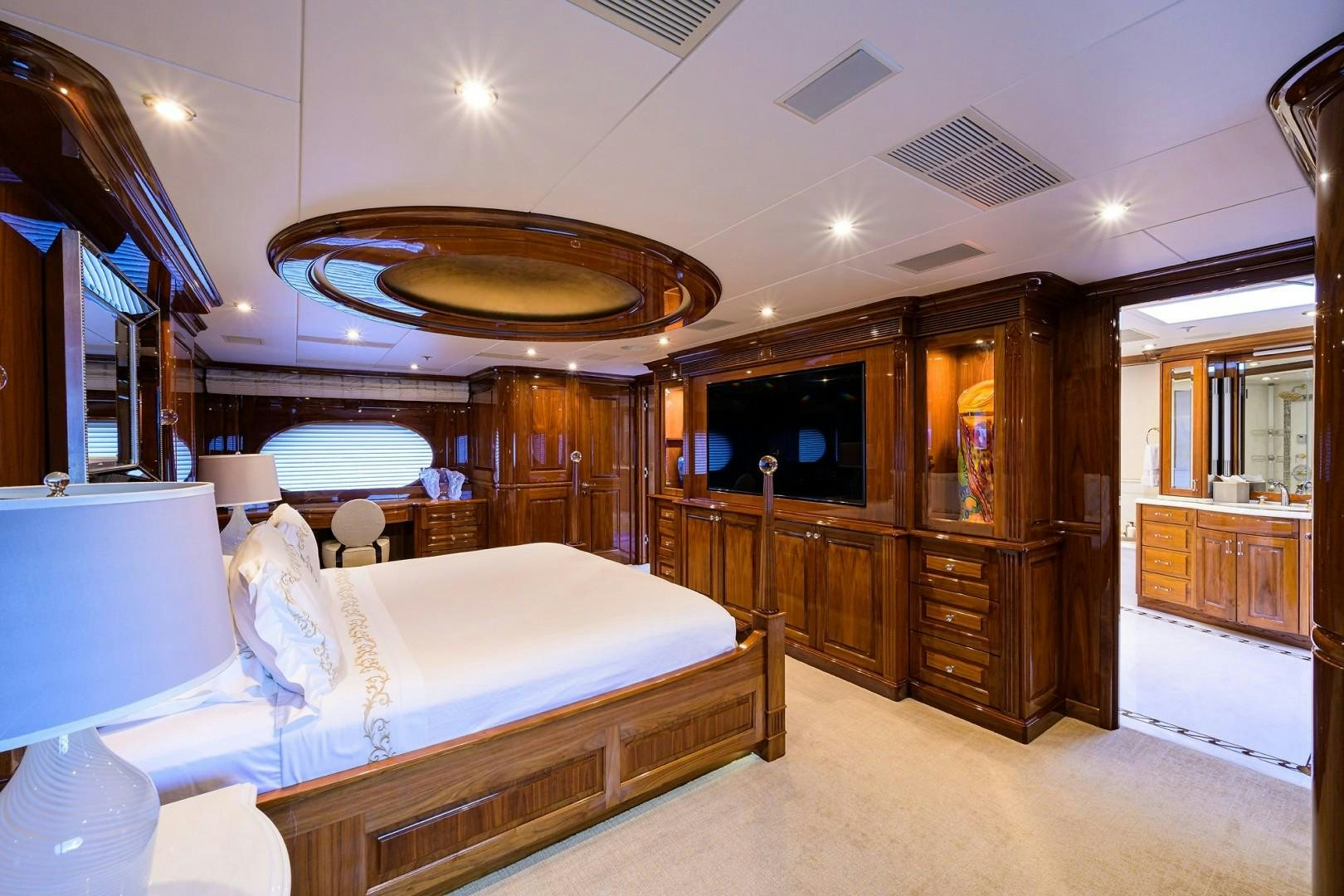a room with a bed and a large mirror aboard REMEMBER WHEN Yacht for Sale