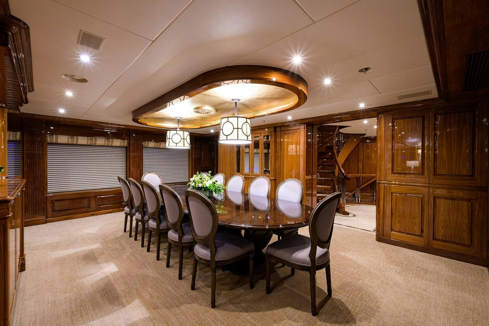 a large dining room with a large chandelier aboard REMEMBER WHEN Yacht for Sale