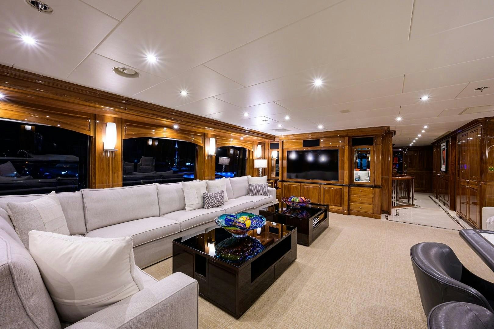 a living room with a large screen aboard REMEMBER WHEN Yacht for Sale
