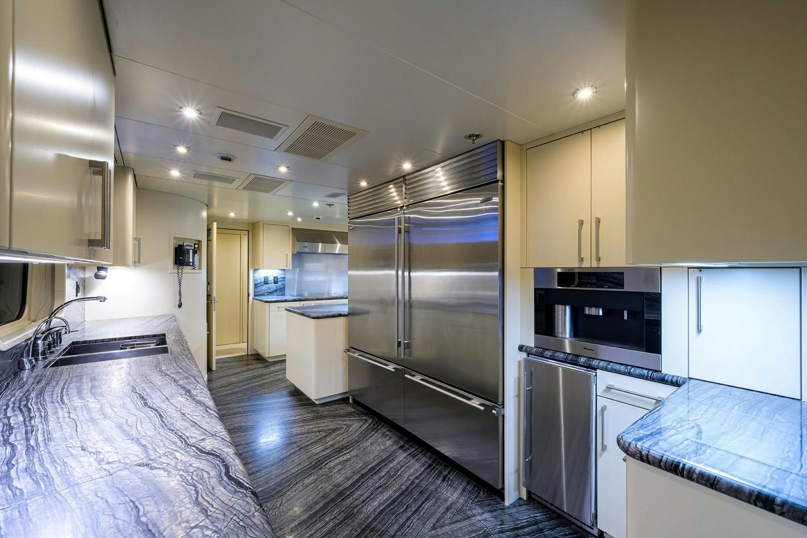 a kitchen with a large refrigerator aboard REMEMBER WHEN Yacht for Sale