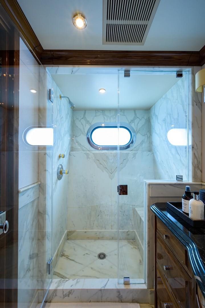 a bathroom with a shower and sink aboard REMEMBER WHEN Yacht for Sale