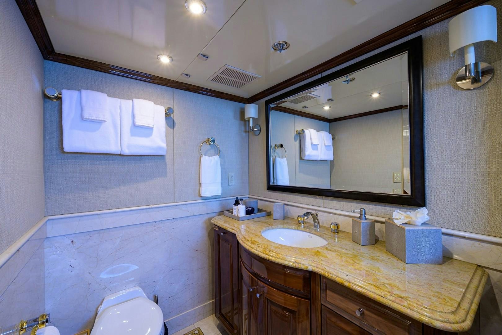 a bathroom with a large mirror aboard REMEMBER WHEN Yacht for Sale