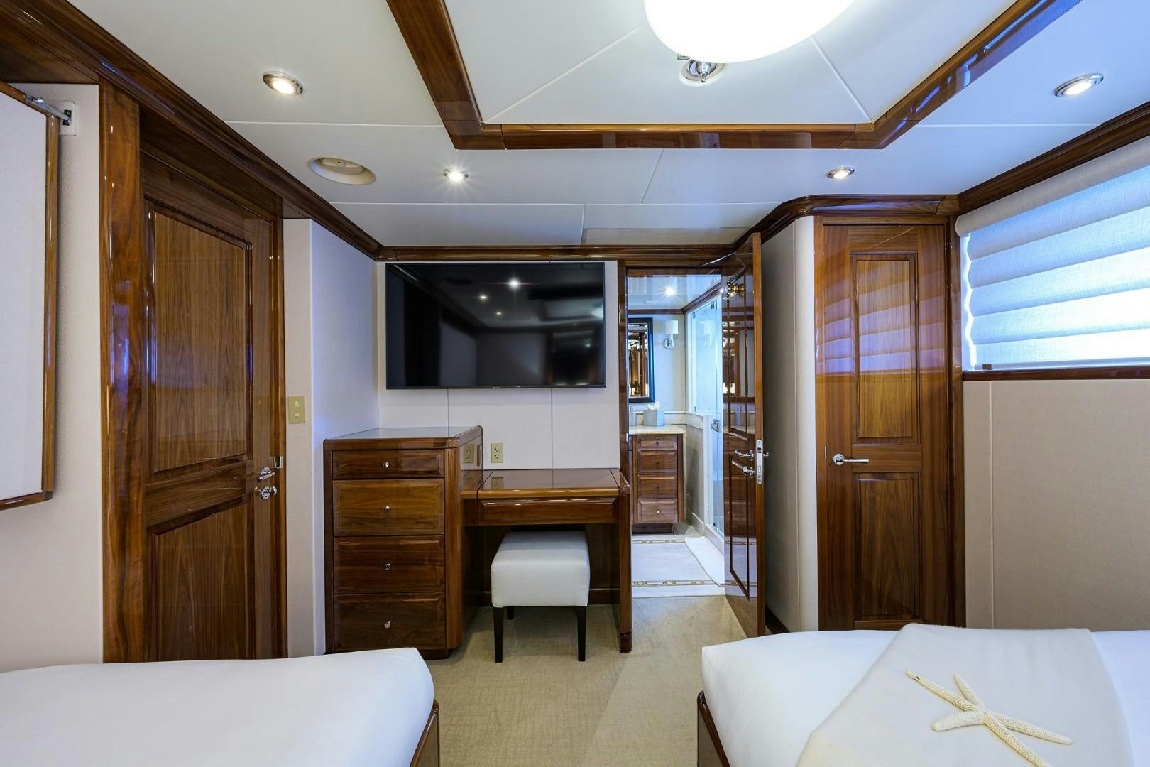 a room with a desk and a bed aboard REMEMBER WHEN Yacht for Sale