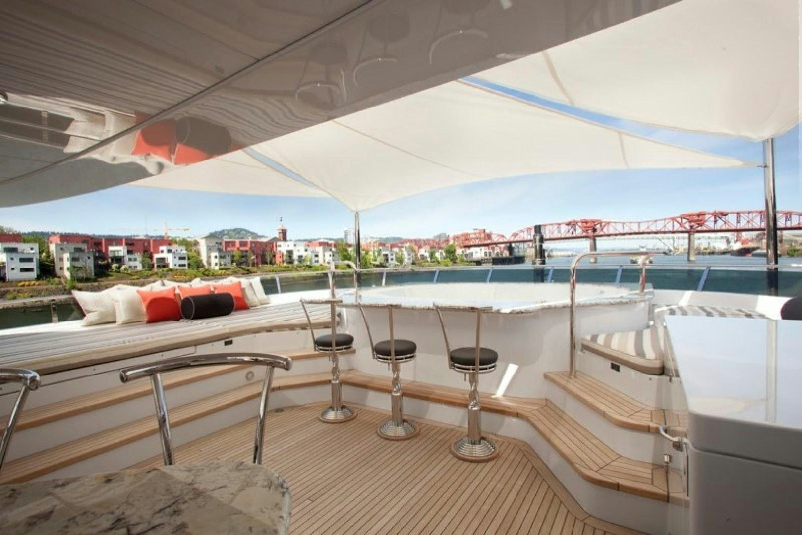 a table and chairs on a deck aboard REMEMBER WHEN Yacht for Sale
