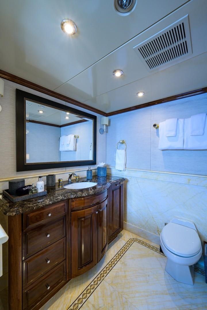 a bathroom with a sink and a mirror aboard REMEMBER WHEN Yacht for Sale
