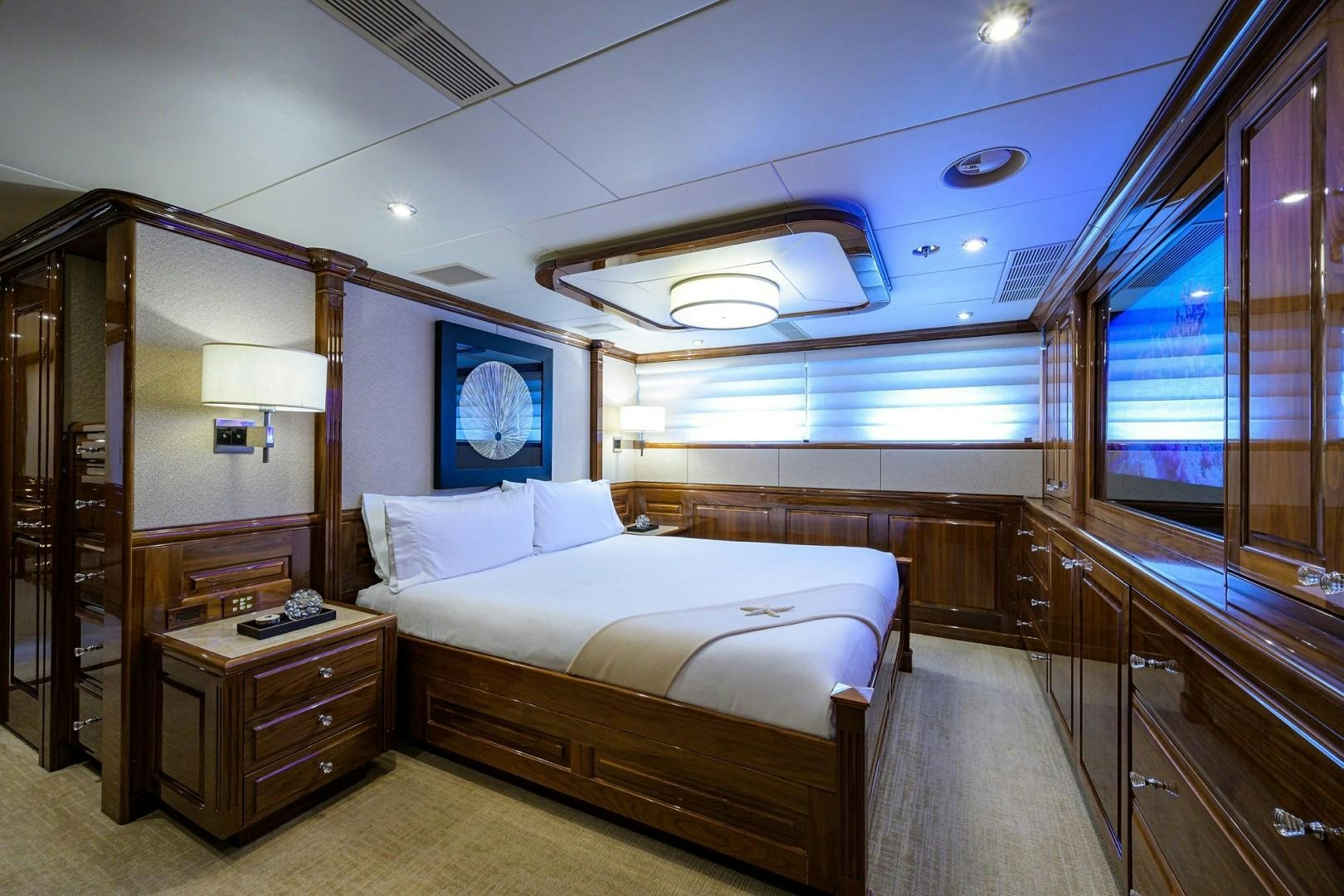 a room with a bed and a desk aboard REMEMBER WHEN Yacht for Sale