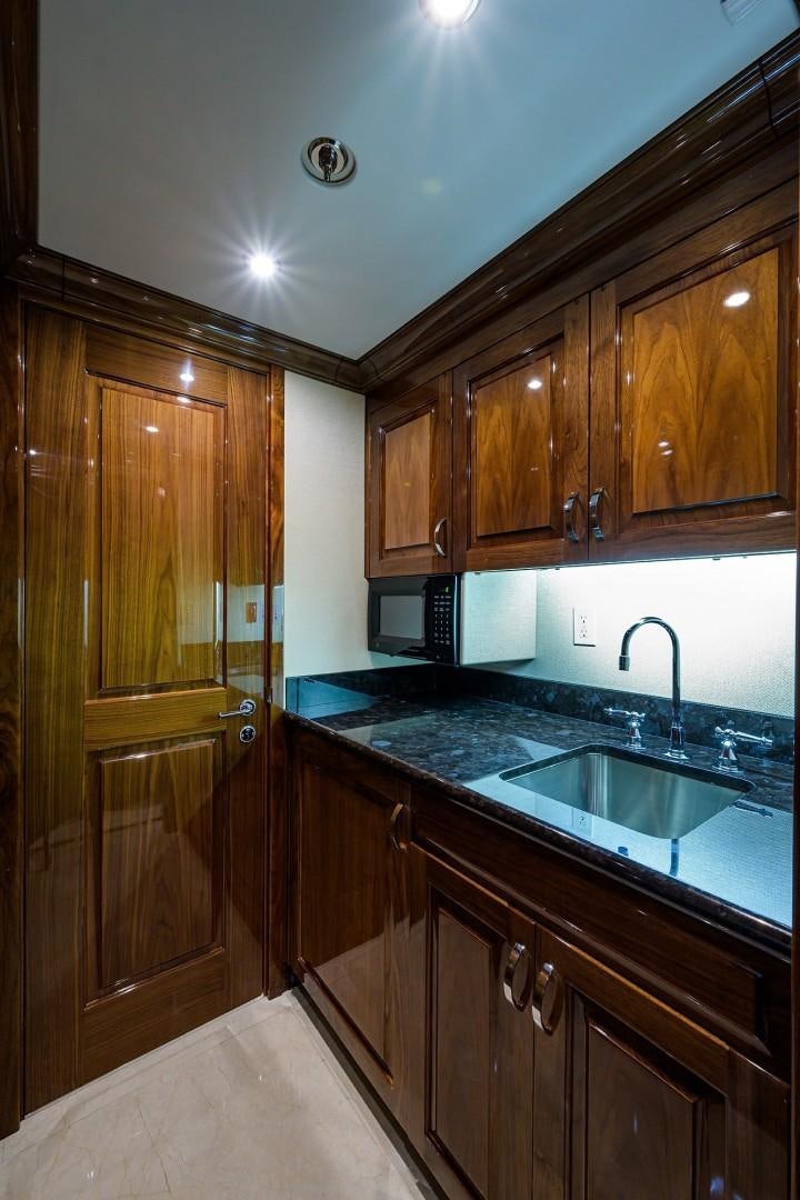 a kitchen with wooden cabinets aboard REMEMBER WHEN Yacht for Sale