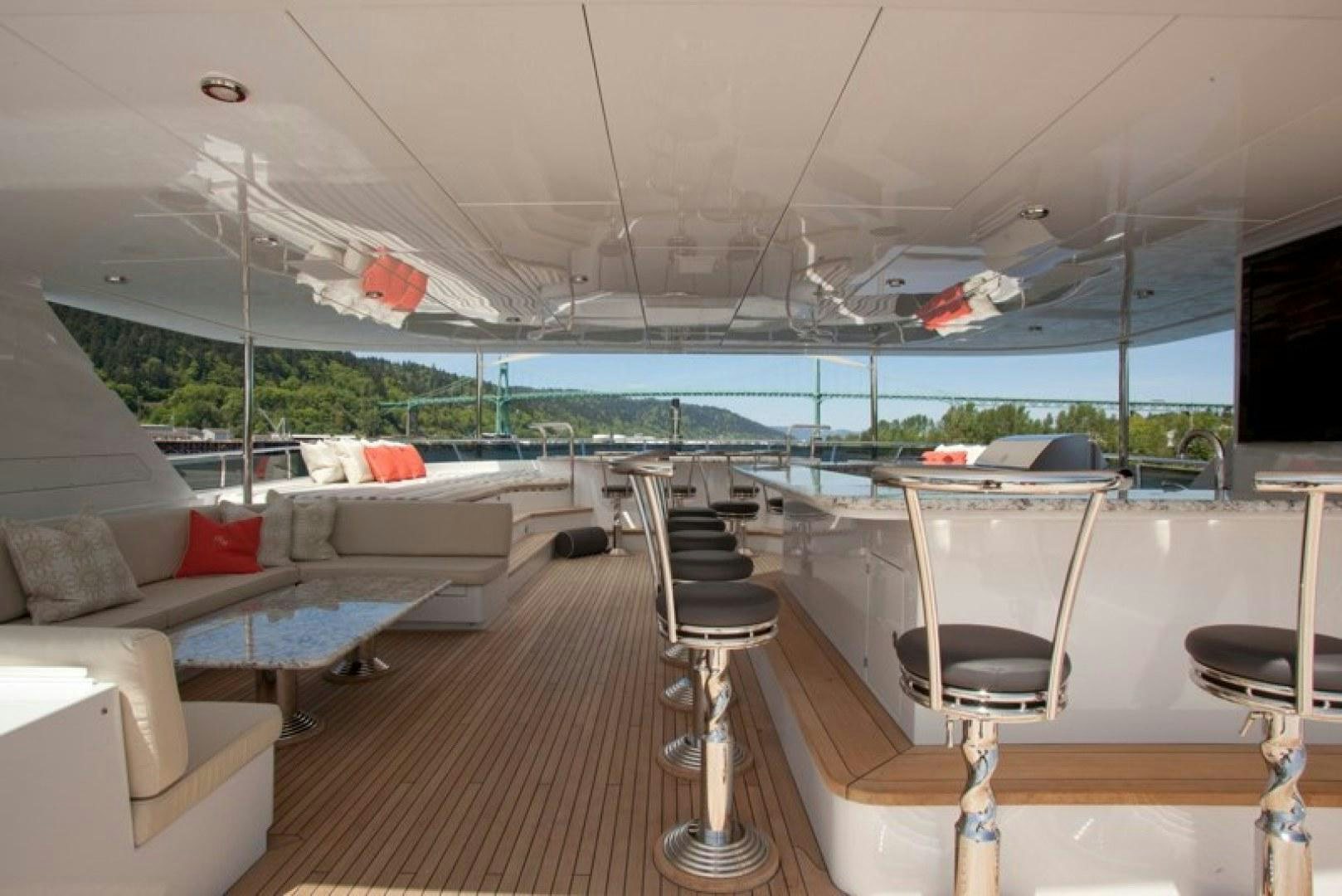 a boat with a deck and chairs aboard REMEMBER WHEN Yacht for Sale