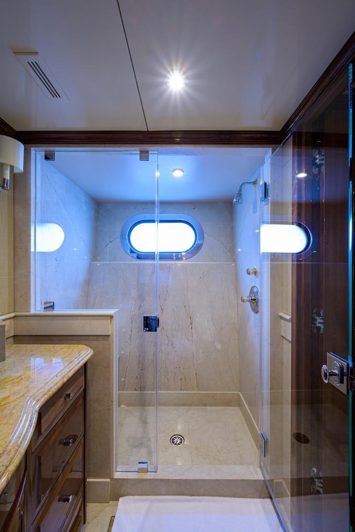 a bathroom with a shower and sink aboard REMEMBER WHEN Yacht for Sale