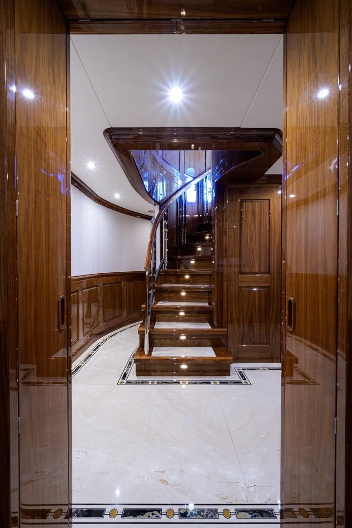 a long hallway with a glass door aboard REMEMBER WHEN Yacht for Sale