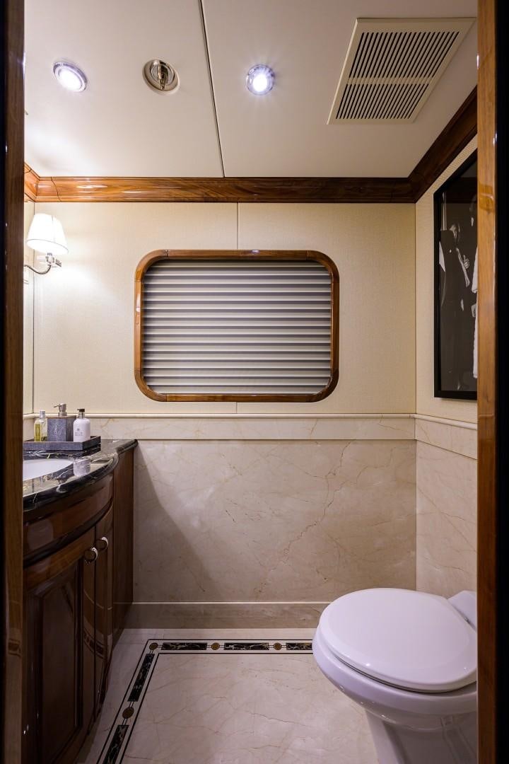 a bathroom with a toilet and a sink aboard REMEMBER WHEN Yacht for Sale
