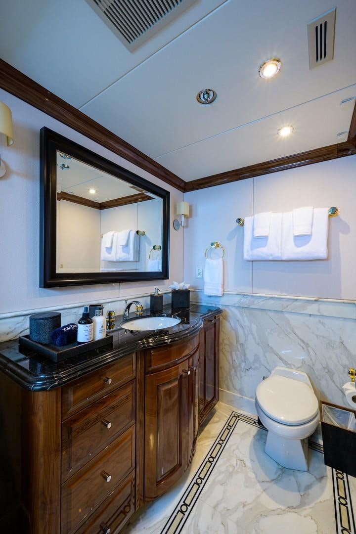a bathroom with a mirror and a sink aboard REMEMBER WHEN Yacht for Sale