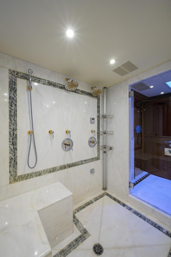 a bathroom with a bathtub and shower aboard REMEMBER WHEN Yacht for Sale