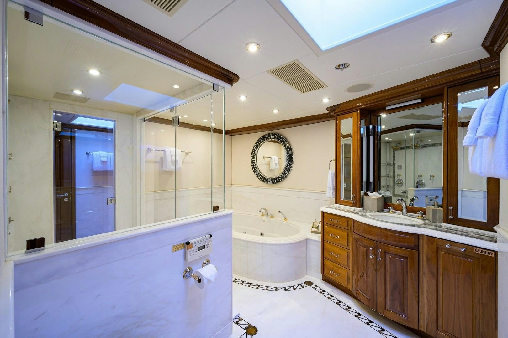 a bathroom with a large mirror aboard REMEMBER WHEN Yacht for Sale