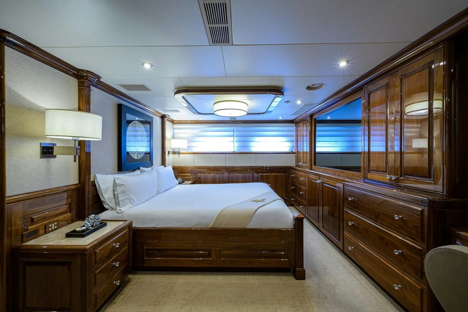 a bedroom with a bed and a desk aboard REMEMBER WHEN Yacht for Sale