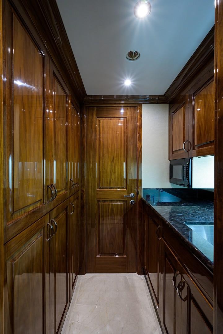 a kitchen with wooden cabinets aboard REMEMBER WHEN Yacht for Sale