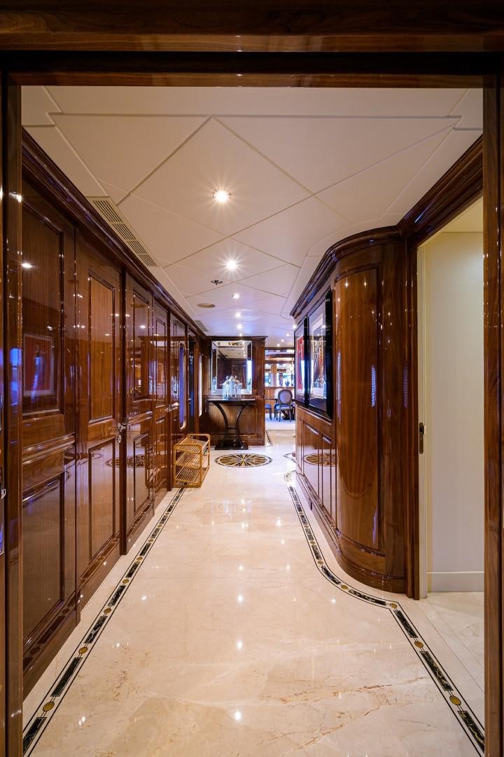a long hallway with glass doors aboard REMEMBER WHEN Yacht for Sale