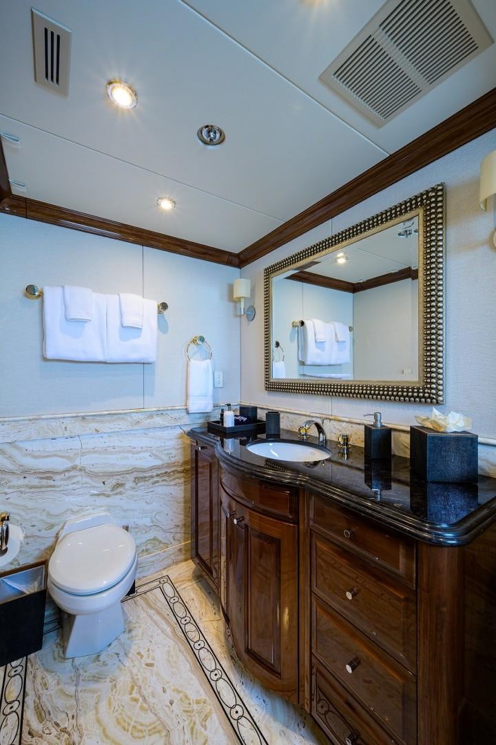a bathroom with a sink and a mirror aboard REMEMBER WHEN Yacht for Sale