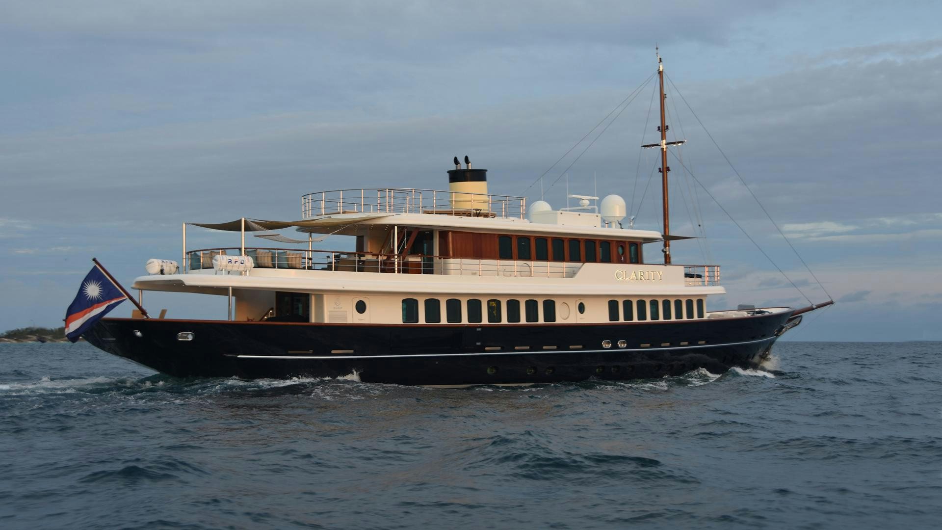 a large boat on the water aboard OMNIA Yacht for Sale
