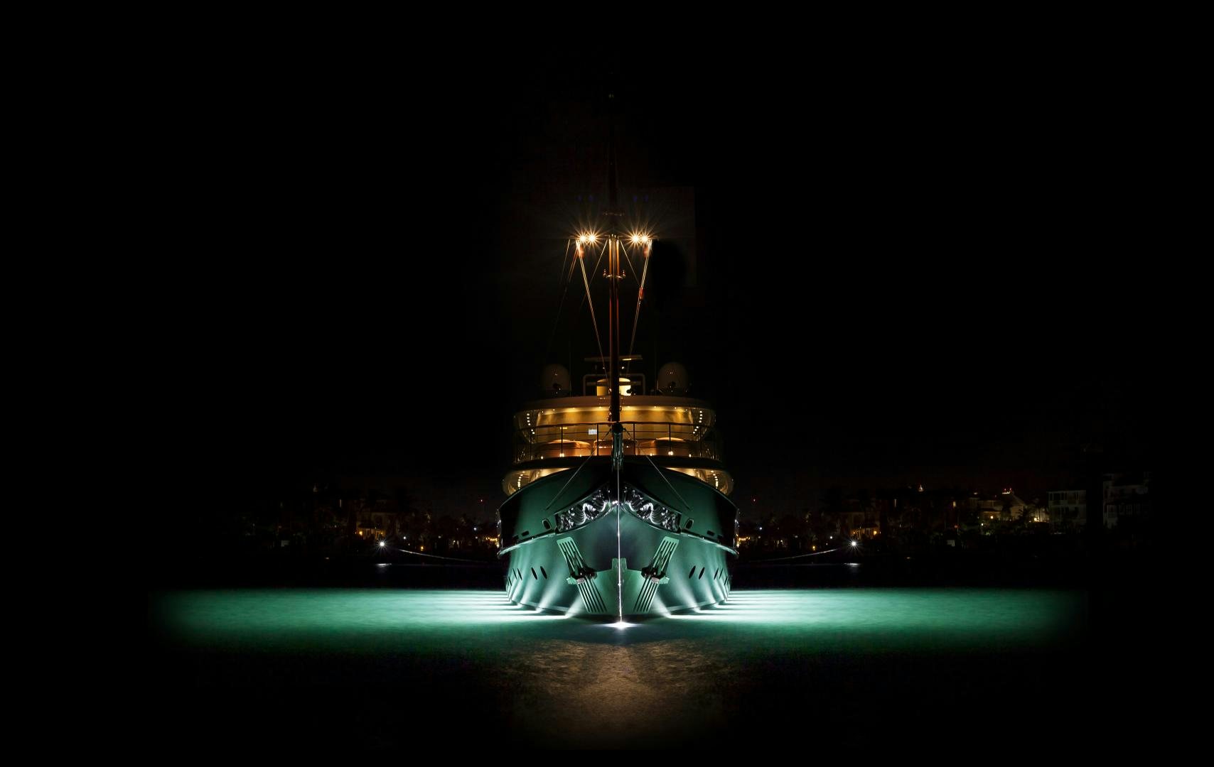 a large lighted tower at night aboard OMNIA Yacht for Sale