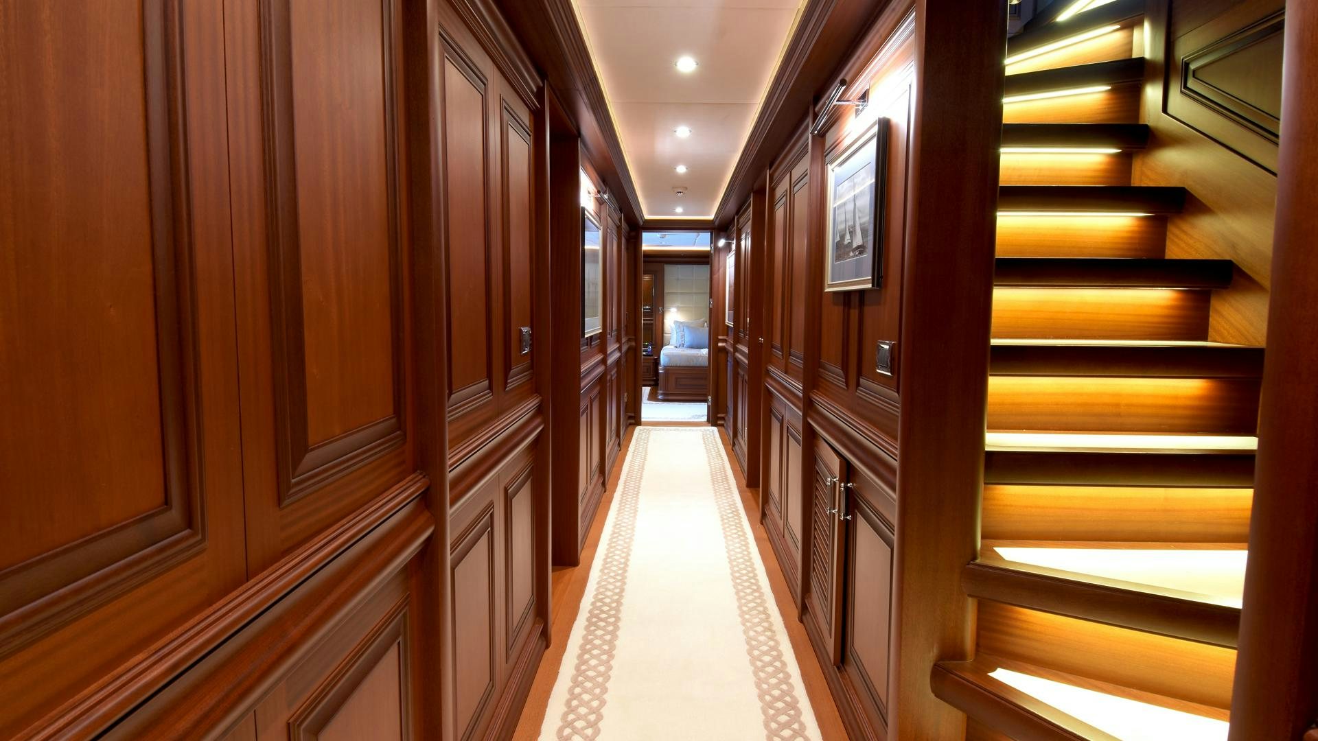 a hallway with several doors aboard OMNIA Yacht for Sale