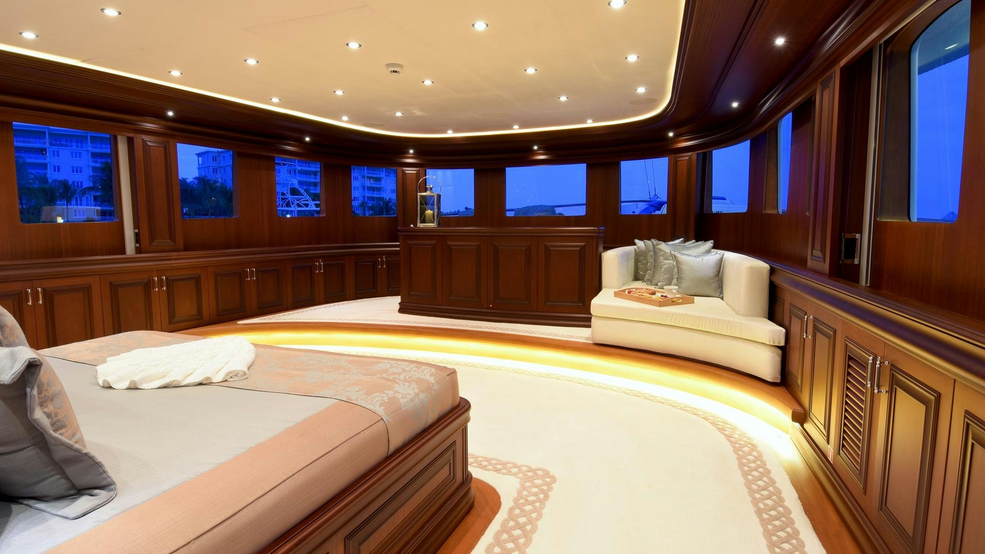 a room with beds and a window aboard OMNIA Yacht for Sale