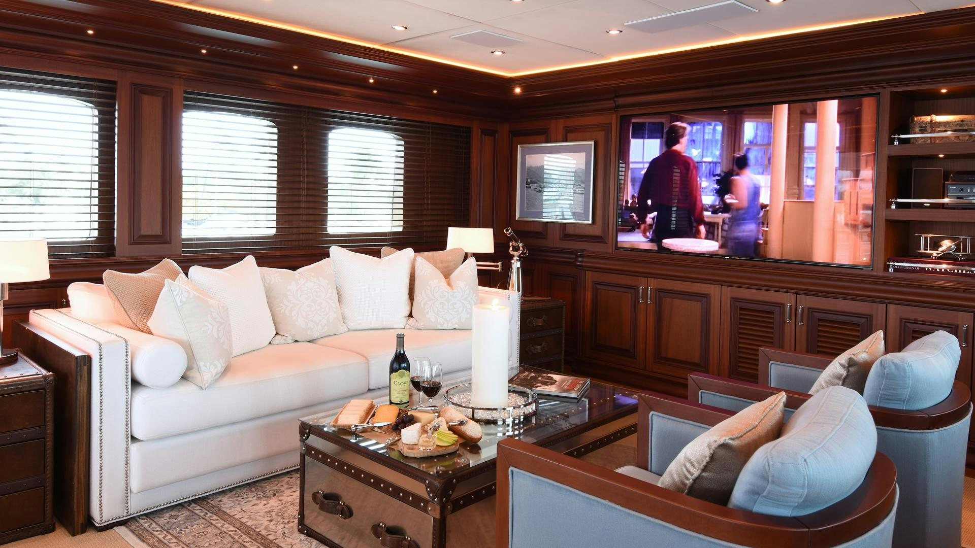 a living room with a large window aboard OMNIA Yacht for Sale