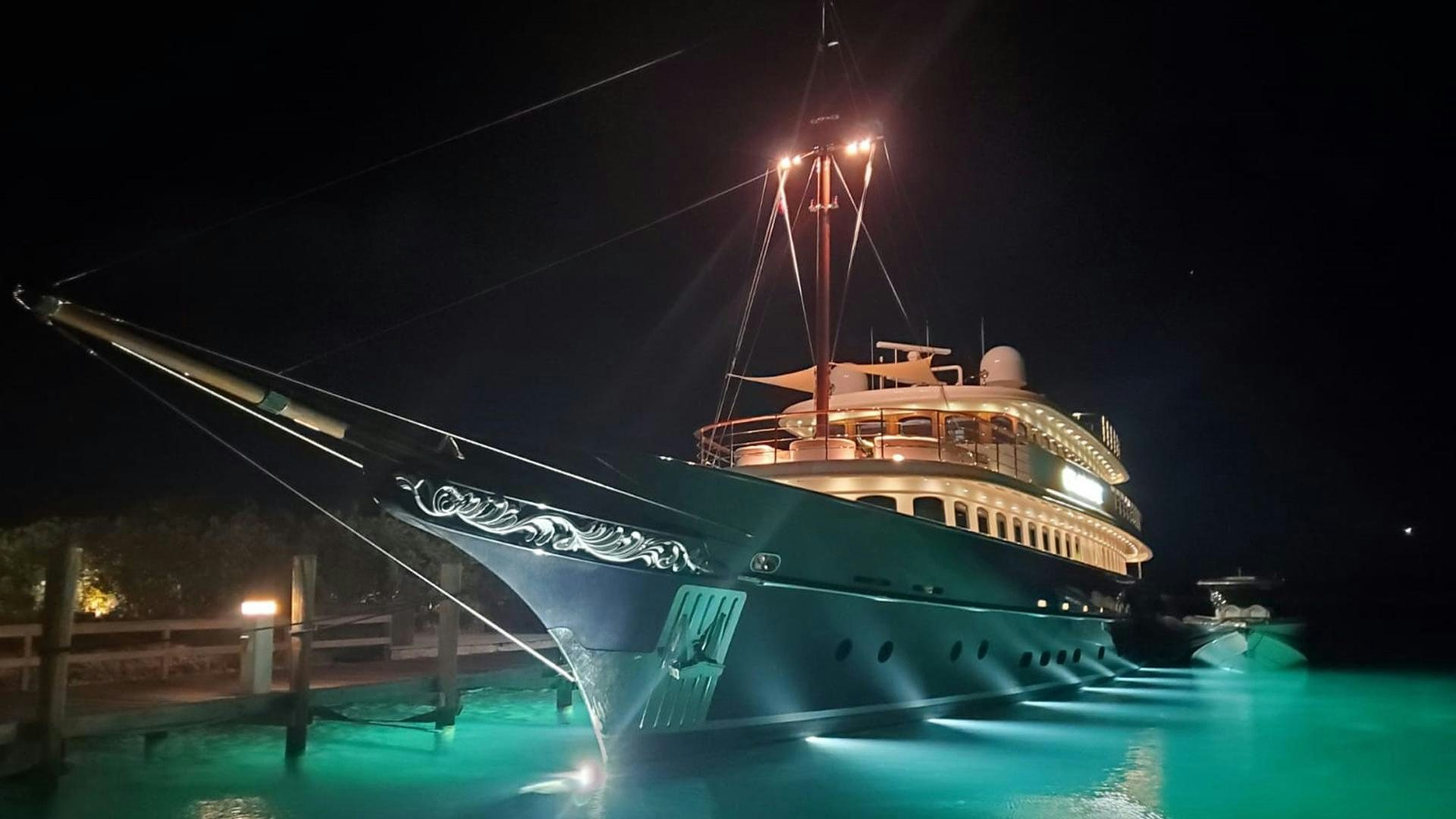 a large ship at night aboard OMNIA Yacht for Sale