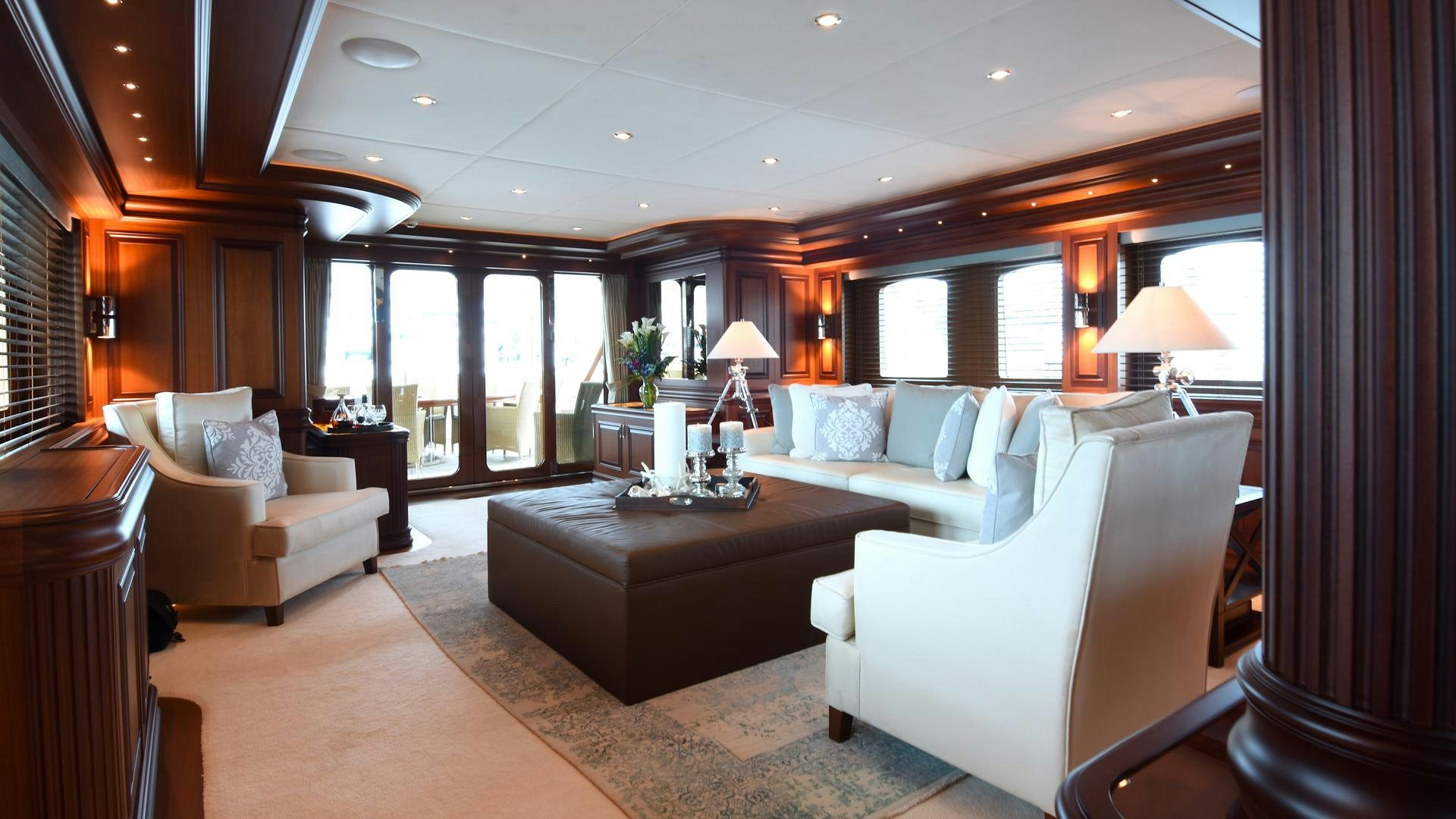 a living room with a large window aboard OMNIA Yacht for Sale