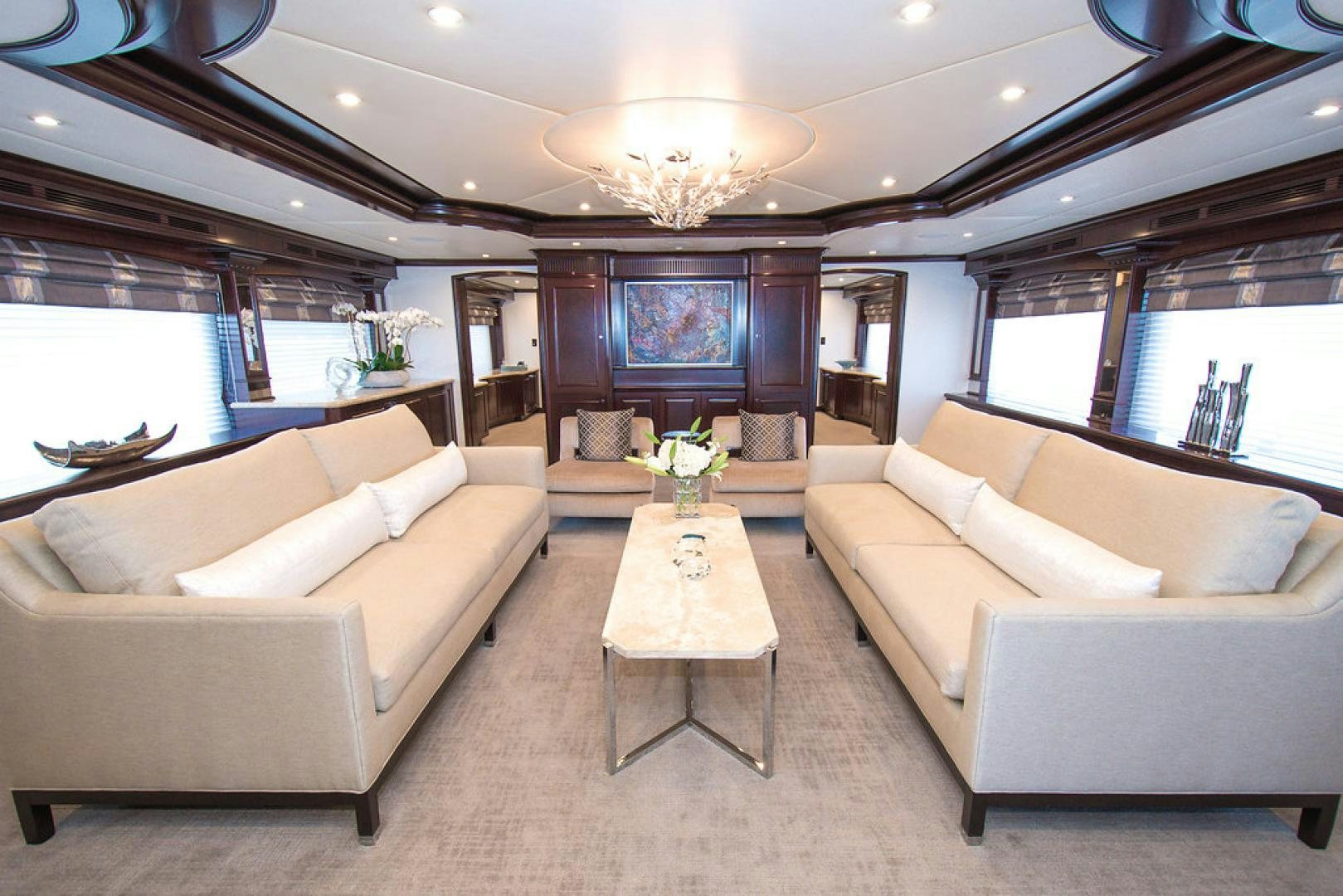 a living room with a large window aboard REBEL Yacht for Sale